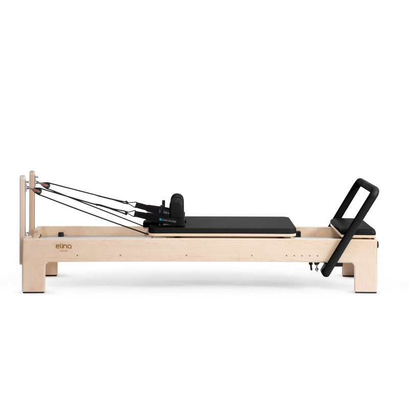 Elite Advanced Reformer side view, black upholstery