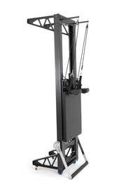 Elina Pilates HL aluminium reformer with tower stood upright on its transport stand