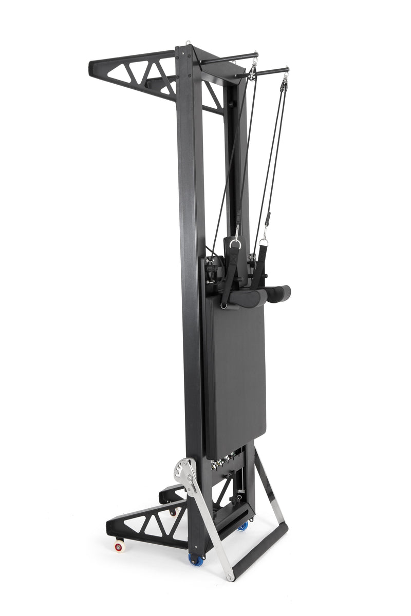 Elina Pilates HL aluminium reformer with tower stood upright on its transport stand