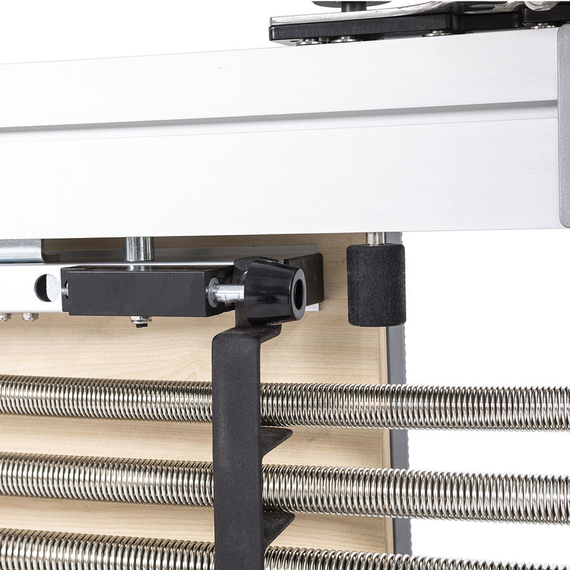 Mentor spring holder and footbar rest detail