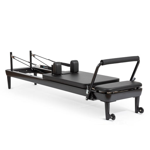 Elina Pilates Nubium Black Edition Reformer, all-black frame, angled studio view