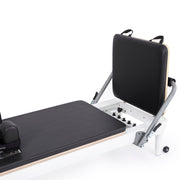 Foot end with the jump board raised showing the spring bar, black