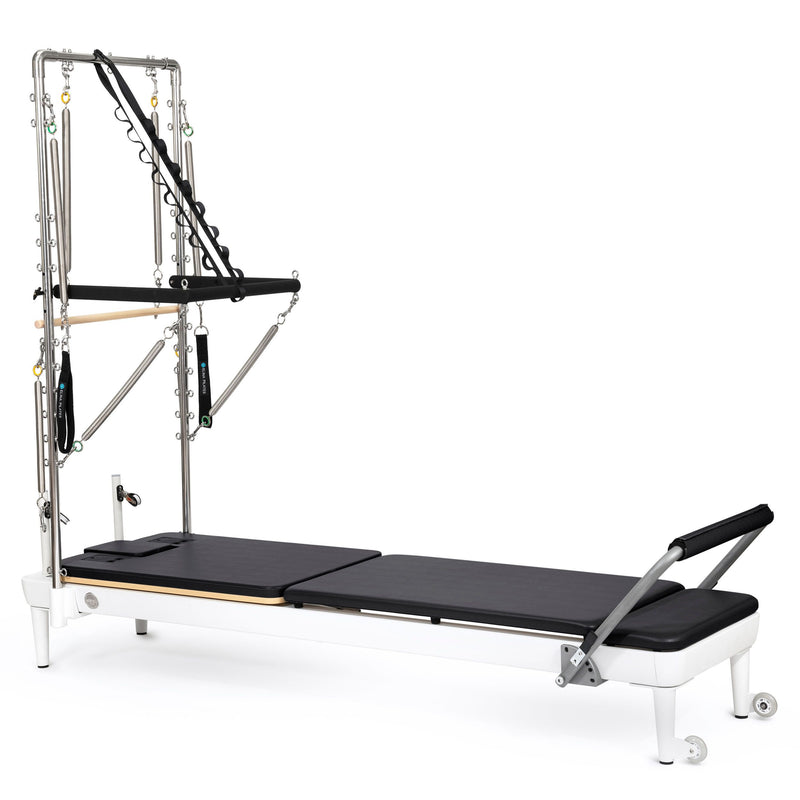 Elina Pilates Nubium Reformer with Tower, white frame with black upholstery, angled studio view
