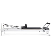 Nubium Reformer side view, black upholstery