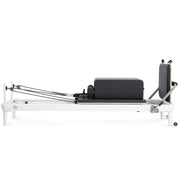 Nubium Reformer side view with sitting box and jump board, black