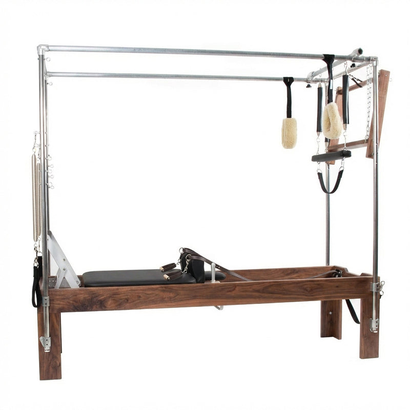 Peak Pilates Artistry Convertible with Vegan Straps in walnut, angled studio view