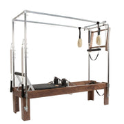 Peak Pilates Artistry Convertible with Vegan Straps in walnut, angled studio view