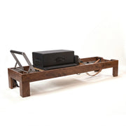 Peak Pilates Artistry Reformer with Leather in walnut, with the Long/Short Box