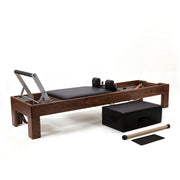 Peak Pilates Artistry Reformer with Leather in walnut, with the Long/Short Box, short box bar and mat