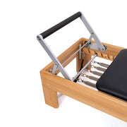 Peak Pilates Artistry Reformer with Rope, four-position contoured footbar detail