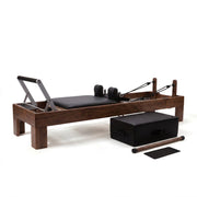 Peak Pilates Artistry Reformer with Rope in walnut, studio view