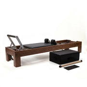 Peak Pilates Artistry Reformer with Vegan Straps in walnut, with the Long/Short Box, short box bar and mat