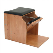 Peak Pilates Artistry Single Pedal Low Chair in beechwood, studio view
