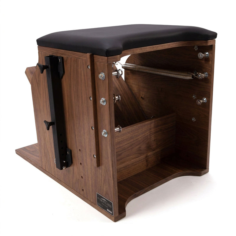Peak Pilates Artistry Split Pedal Low Chair in walnut, studio view