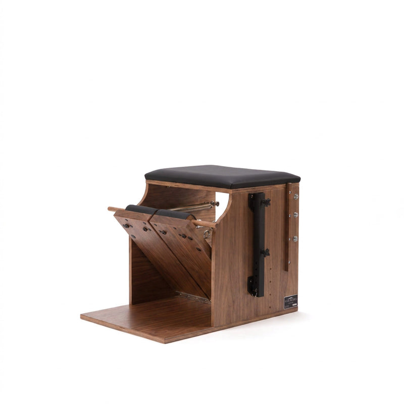 Peak Pilates Artistry Split Pedal Low Chair in walnut, studio view