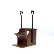 Peak Pilates Artistry Split Pedal Low Chair with Handles & Brackets in walnut, studio view