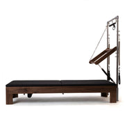 Peak Pilates Artistry TWS with Leather Straps in walnut, side view
