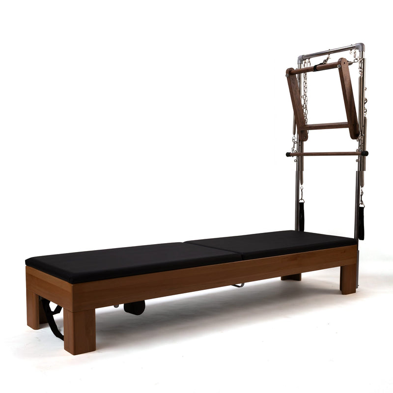 Peak Pilates Artistry TWS with Leather Straps in walnut, with the jump board fitted
