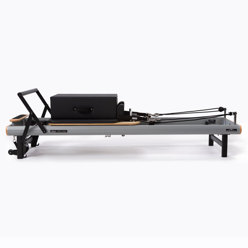 Peak Pilates casa Reformer Bundle, with integrated transport wheels