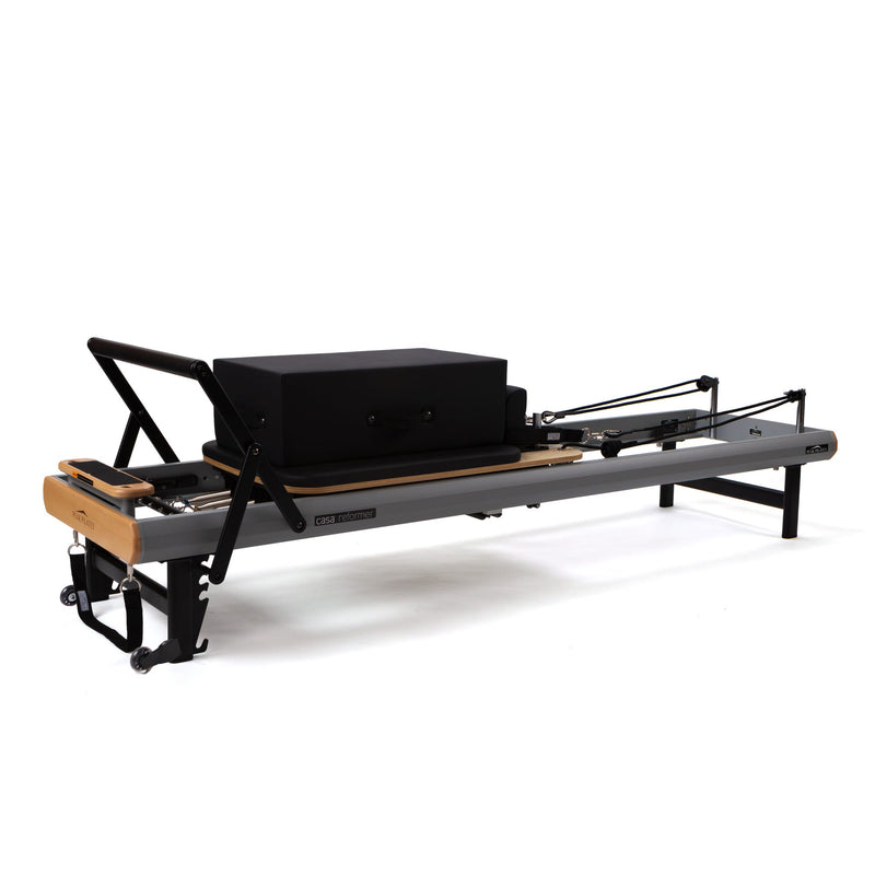 Peak Pilates casa Reformer Bundle, with integrated transport wheels