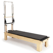 Elina Pilates Physio Wood Reformer with Tower, black, side view with mat laid flat