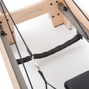 Elite Wood Reformer rope and strap anchor under the frame