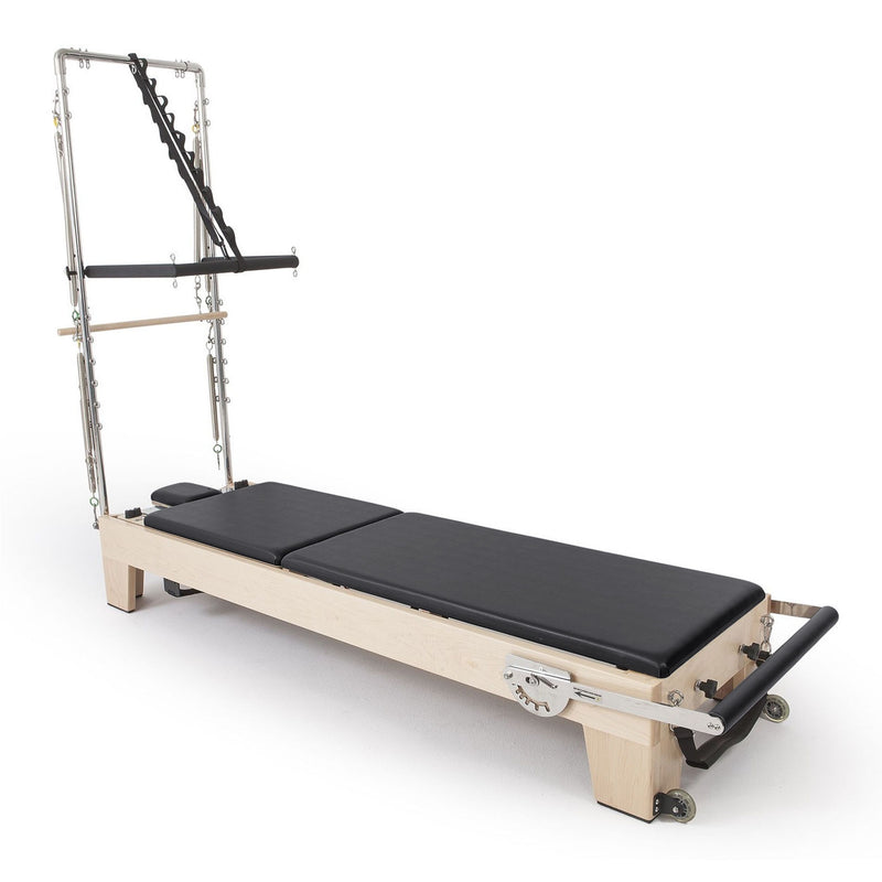 Elina Pilates Elite Wood Reformer with Tower in black, angled studio view