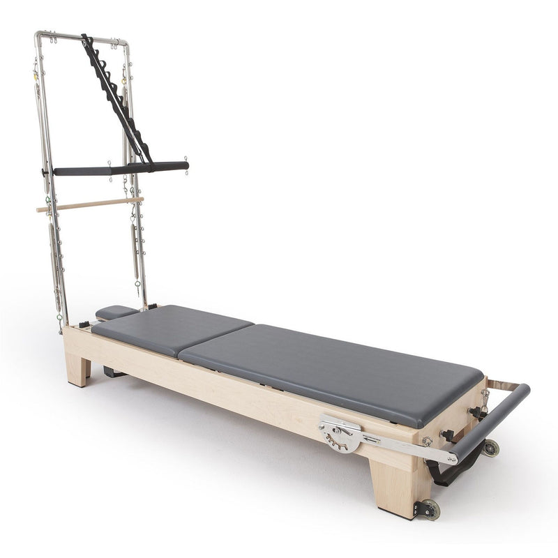 Elite Wood Reformer with Tower in grey, angled studio view