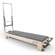 Elite Wood Reformer with Tower in black, side view