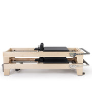 Two Elite Wood Reformers stacked, black upholstery