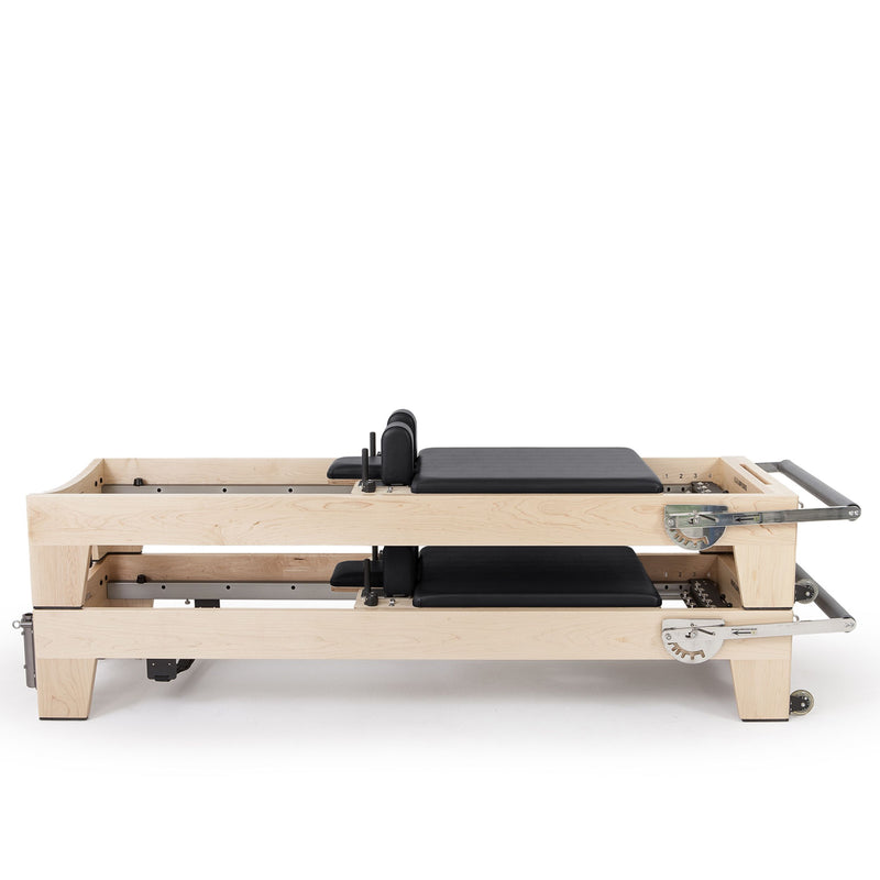 Two Elite Wood Reformers stacked, black upholstery