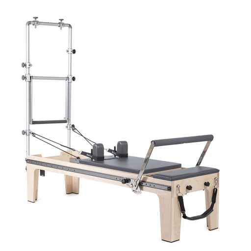 Elina Pilates Master Instructor Physio Reformer with Tower in grey, angled studio view