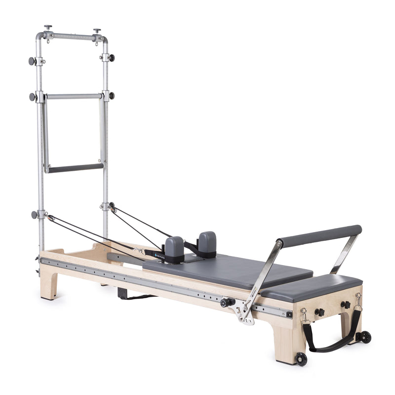 Master Instructor Reformer with Tower in grey, angled studio view