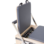 Jump board stored upright over the spring rack, grey