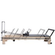 Master Instructor Reformer side view showing the footbar travel range