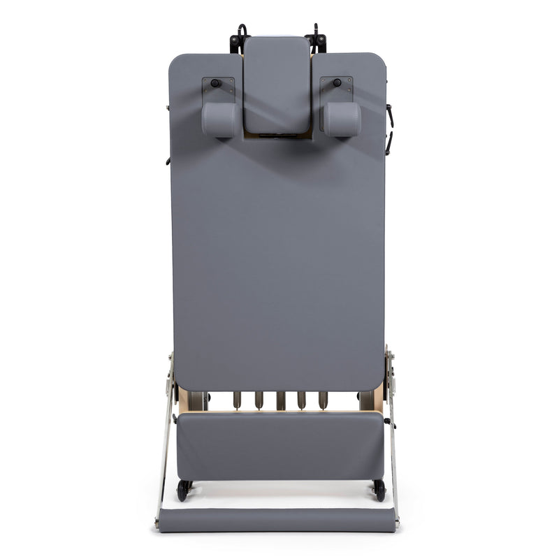 Rear view of the folded Fold Reformer standing upright, grey