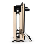 Fold Reformer folded and standing on its wheels, black