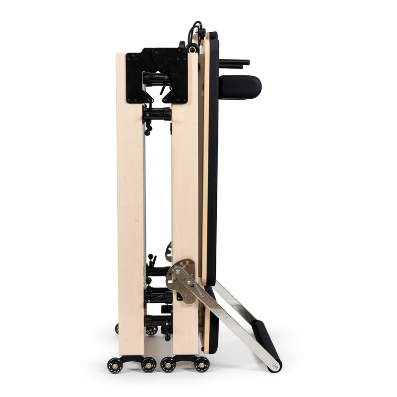 Fold Reformer folded and standing on its wheels, black