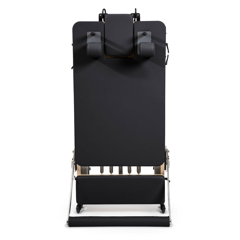 Rear view of the folded Fold Reformer standing upright, black