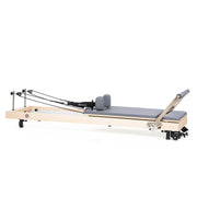 Vertical Reformer with sitting box and jump board raised, grey