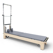 Club Reformer with the bare tower frame showing the eyelet rows, grey