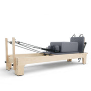 Club Reformer with box pads and jump board raised at the foot end, grey