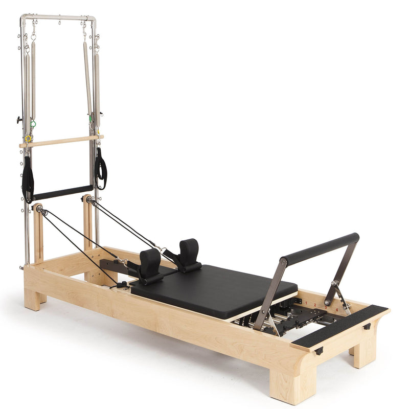 Elina Pilates Wood Reformer with Tower in black, angled studio view