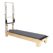 Elina Pilates Wood Reformer with Tower, grey, side view with mat laid flat