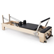 Elina Pilates Elite Wood Reformer in black, angled studio view