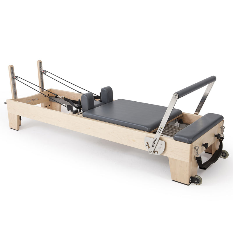 Elina Pilates Elite Wood Reformer in grey, angled studio view