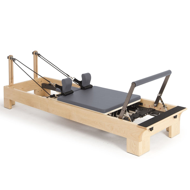 Elina Pilates Wood Reformer Bundle in grey, angled studio view