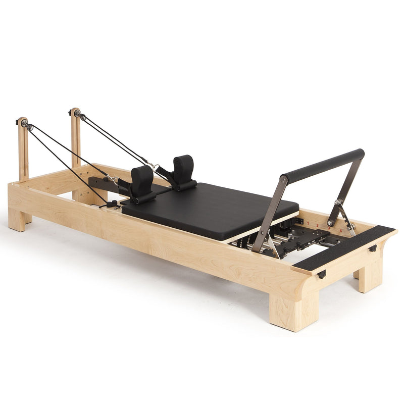 Elina Pilates Wood Reformer Bundle in black, angled studio view