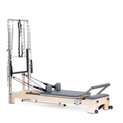 Lignum Reformer with Tower in grey, ropes and shoulder rests visible