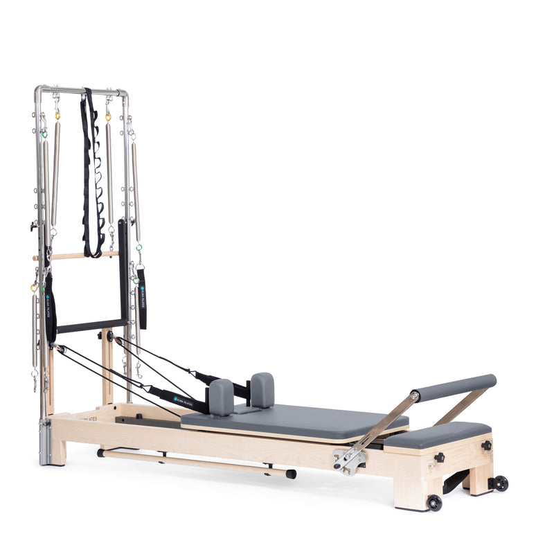 Lignum Reformer with Tower in grey, ropes and shoulder rests visible